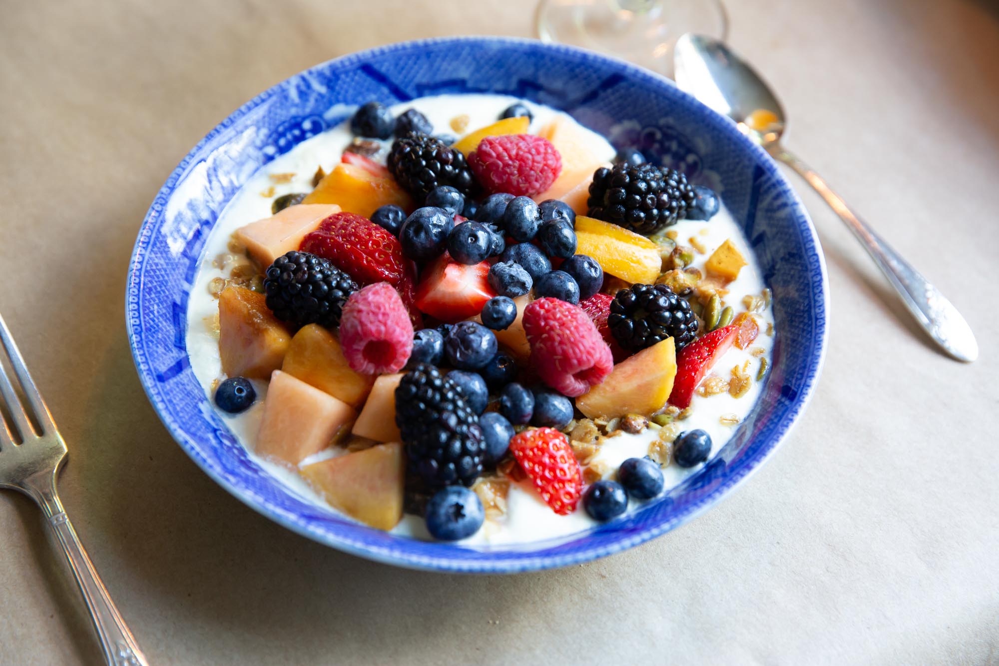The Inn at Kenmore Hall breakfast bowl of yogurt granola and fresh fruit