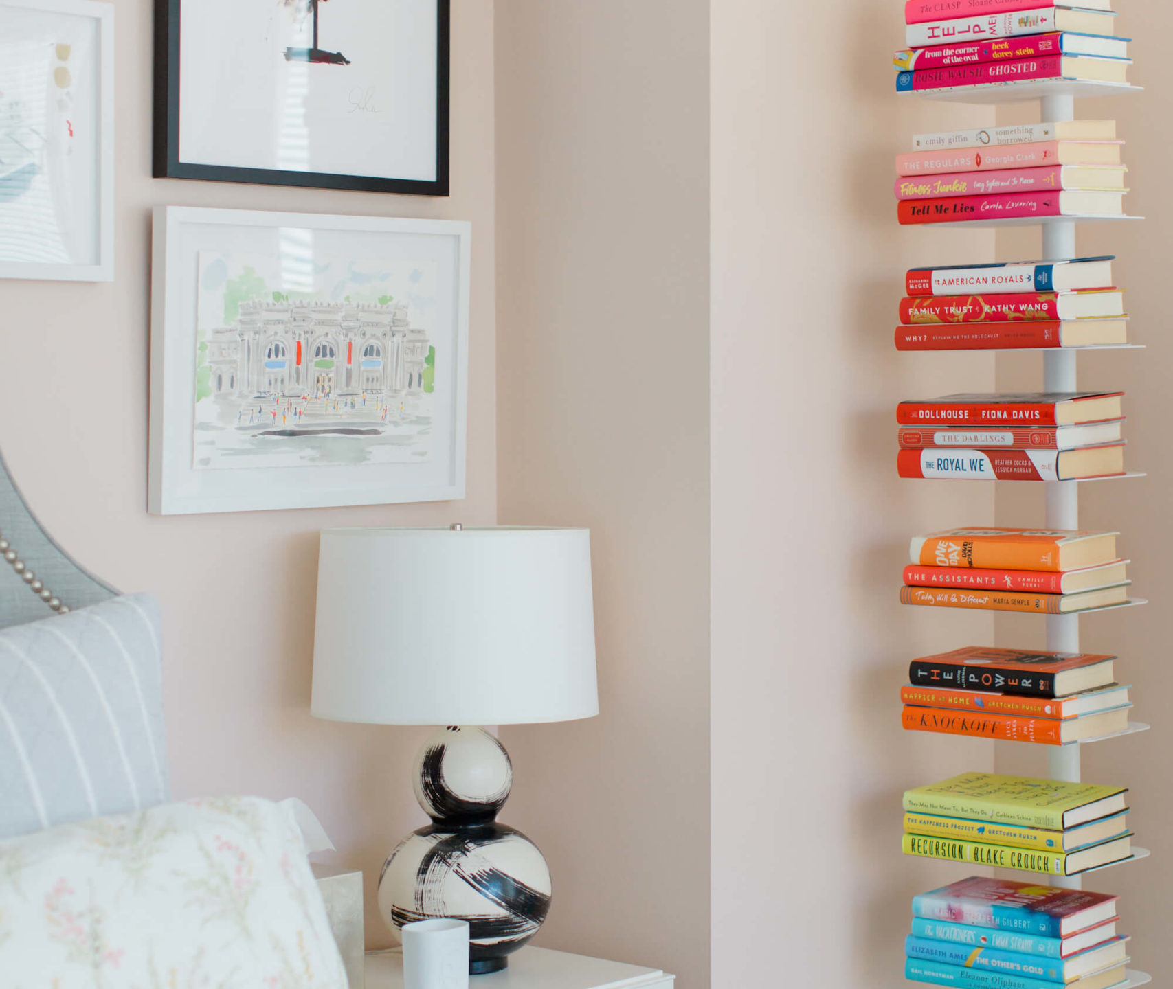 color coded bookshelves in a studio apartment