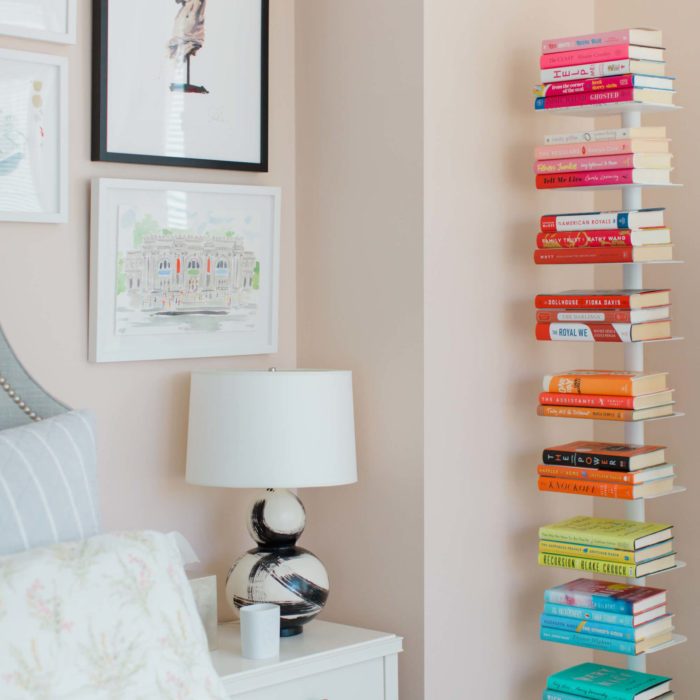color coded bookshelves in a studio apartment